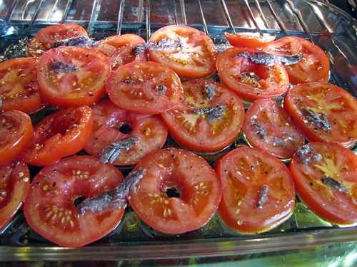 Roasting tomatoes and anchovies