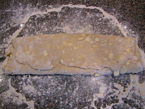 fold dough into thirds and then into thirds again to make a perfect square, roll out and repeat another two times